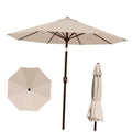 Beige round patio market umbrella with open canopy and dark center ribs