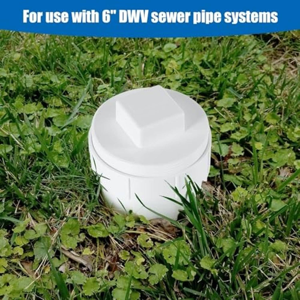 White PVC sewer cleanout adapter with plug cap, outdoor ground positioning