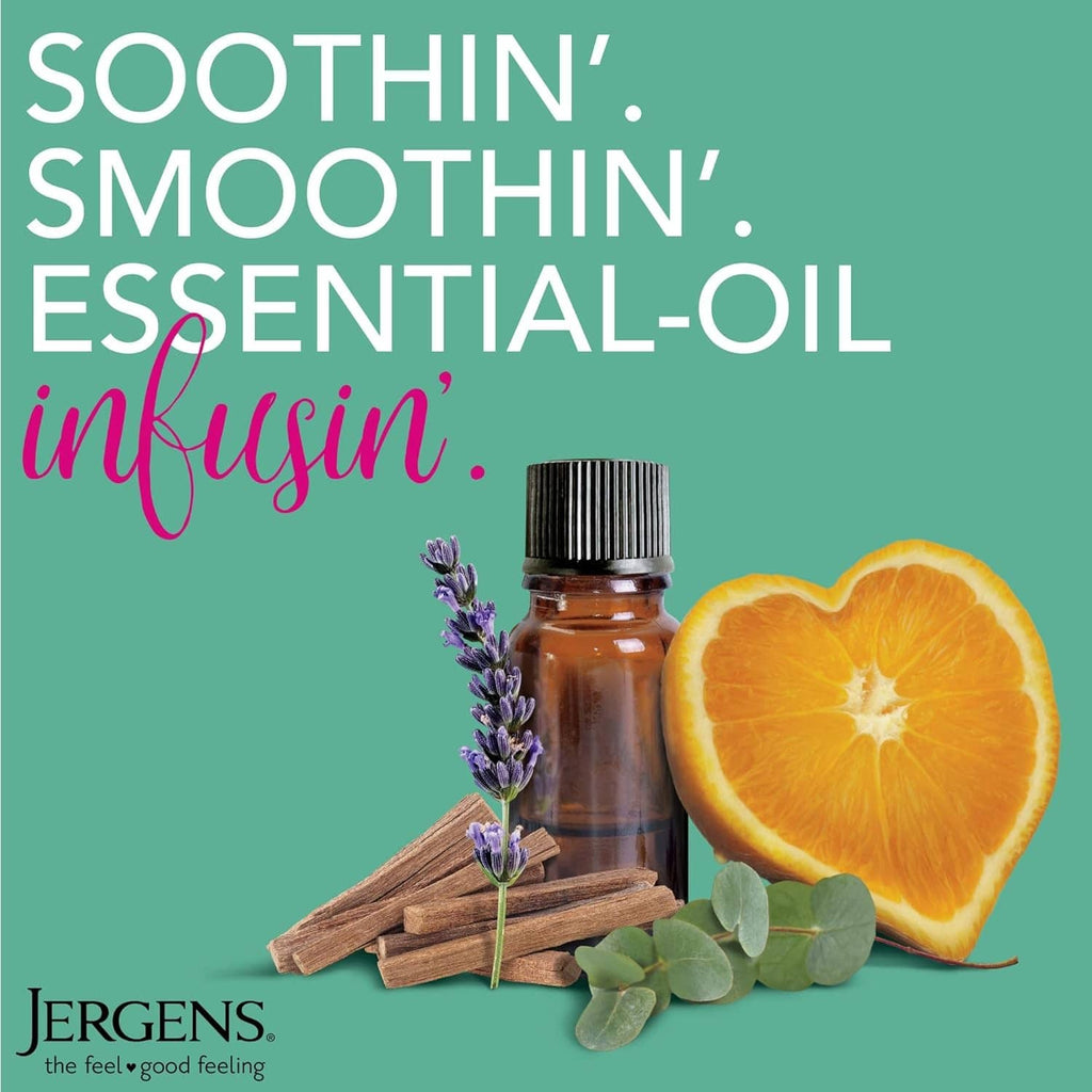 Amber essential oil bottle with black cap and lavender sprig beside citrus slices.