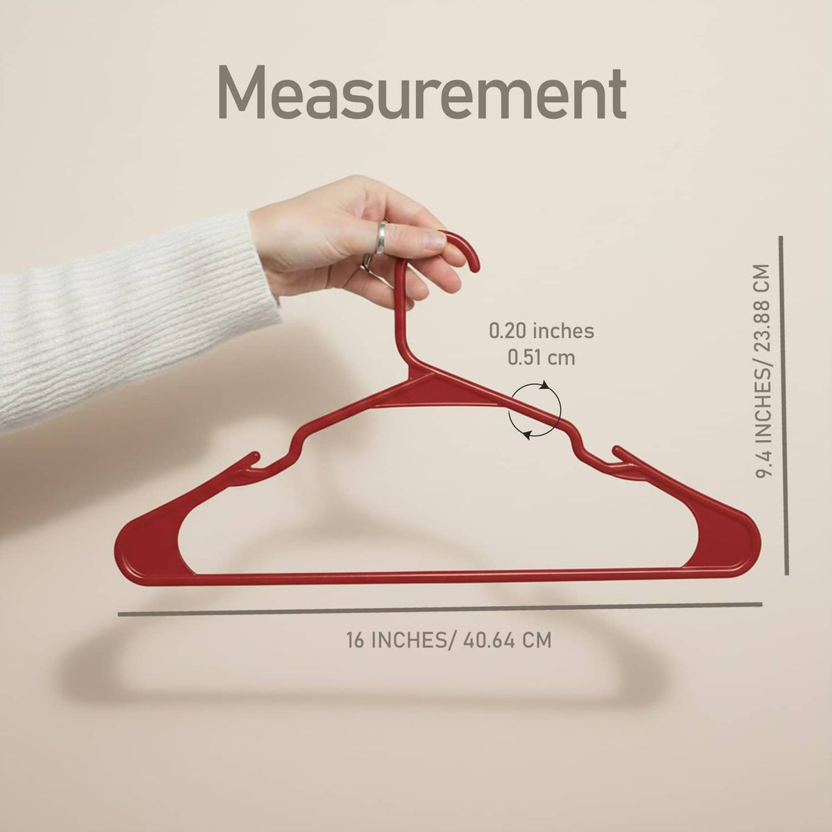 Red plastic clothes hanger with curved shoulders and hook, shown with size guide