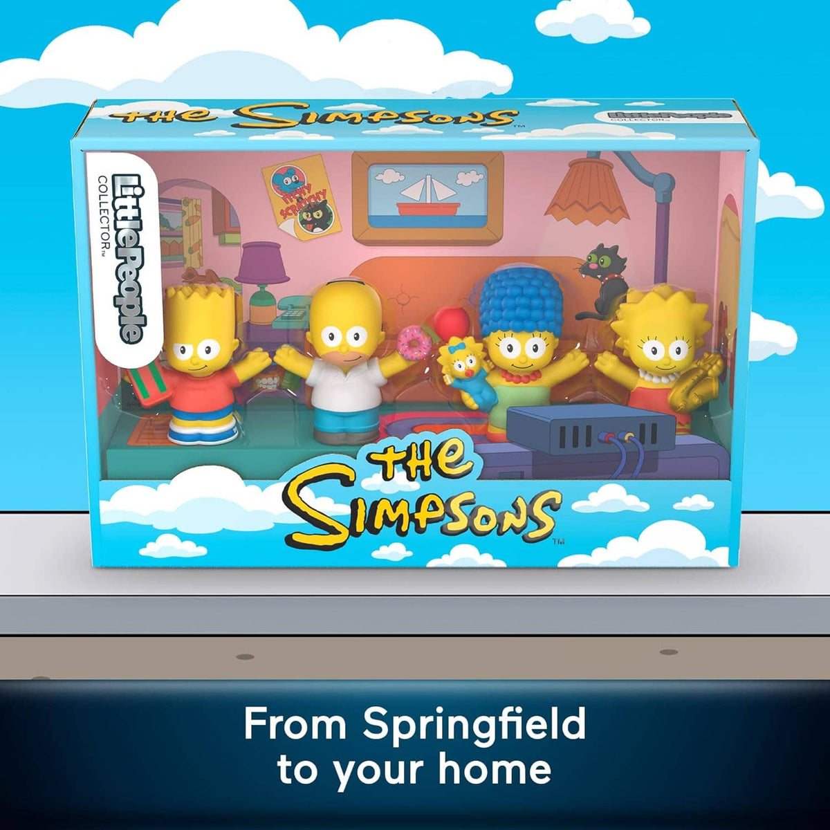 Simpsons collectible figure set display box front showing four figures in living-room scene