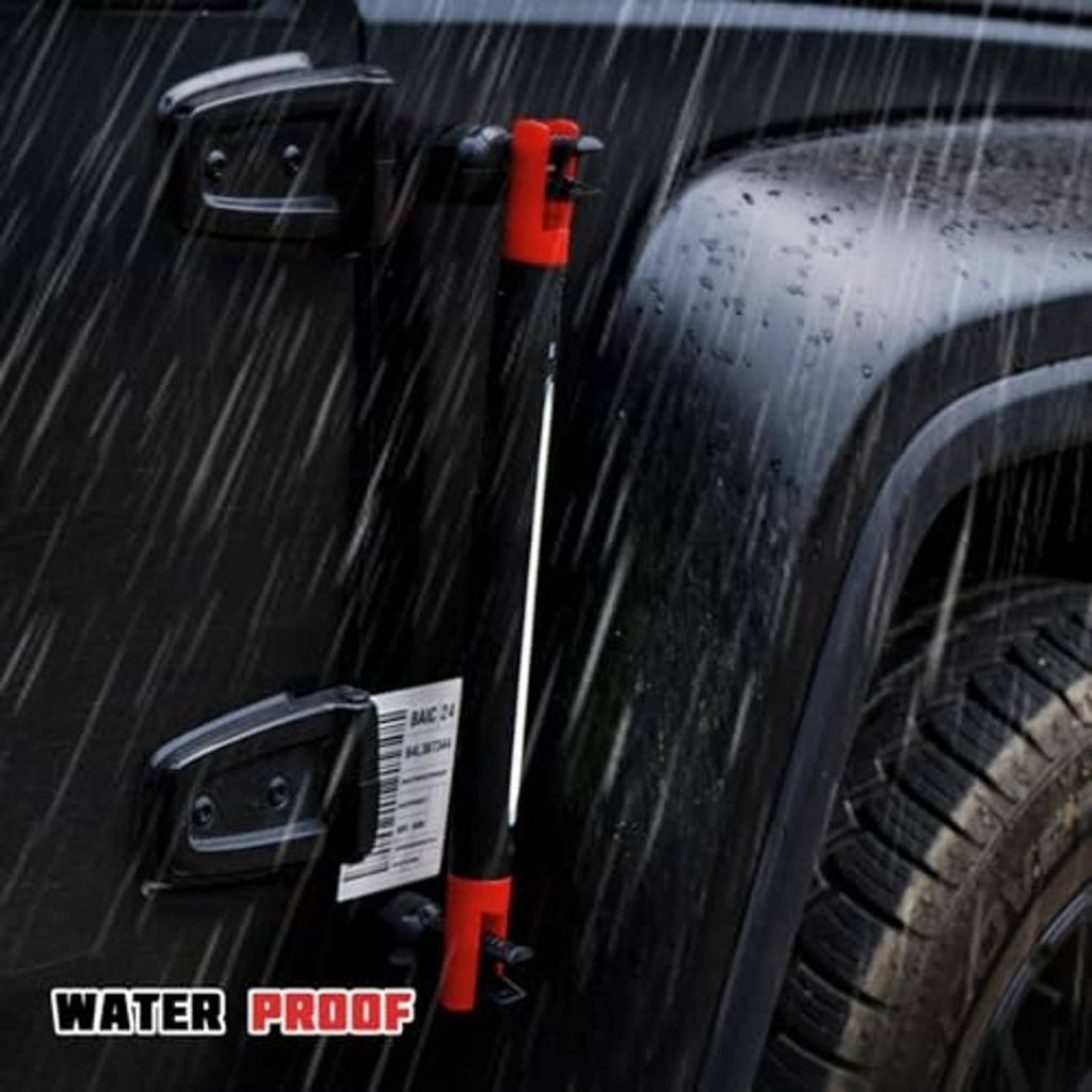 Magnetic auto repair light bar in rain, attached near car wheel with beam on