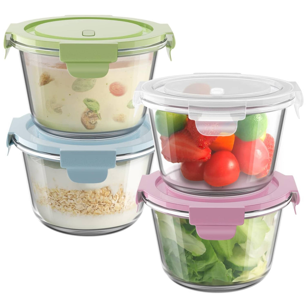 Clear glass meal prep containers with airtight snap lids in green, blue, and pink.