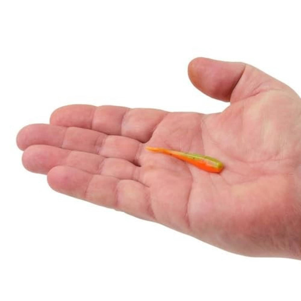 Soft plastic fishing bait in hand, orange-yellow minnow with green tail
