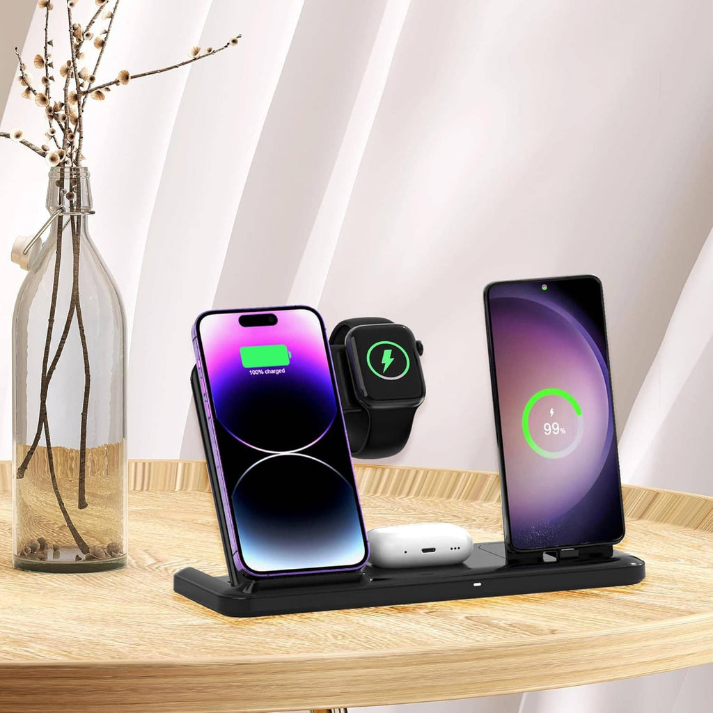 4-in-1 wireless charging station with phone, smartwatch, and earbuds on desk