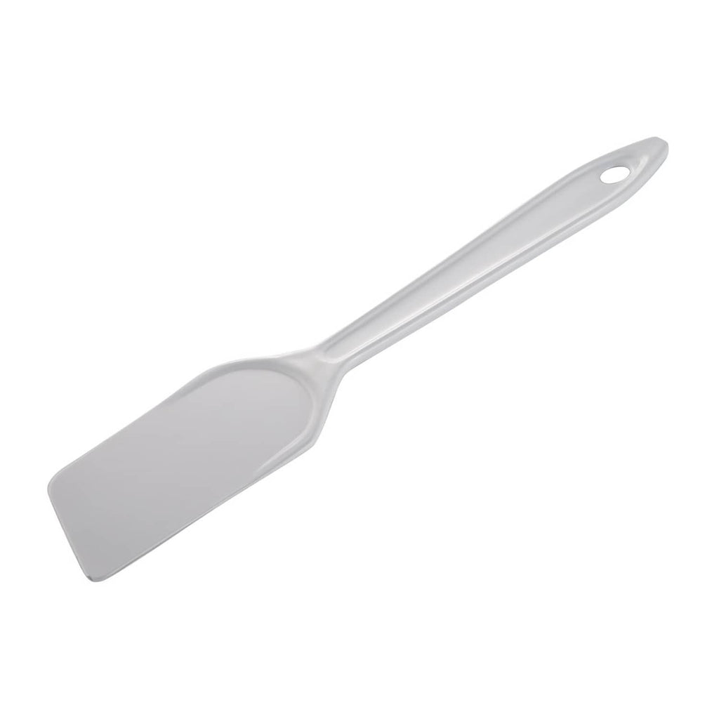 White plastic flat spatula with curved blade and oval hole on handle
