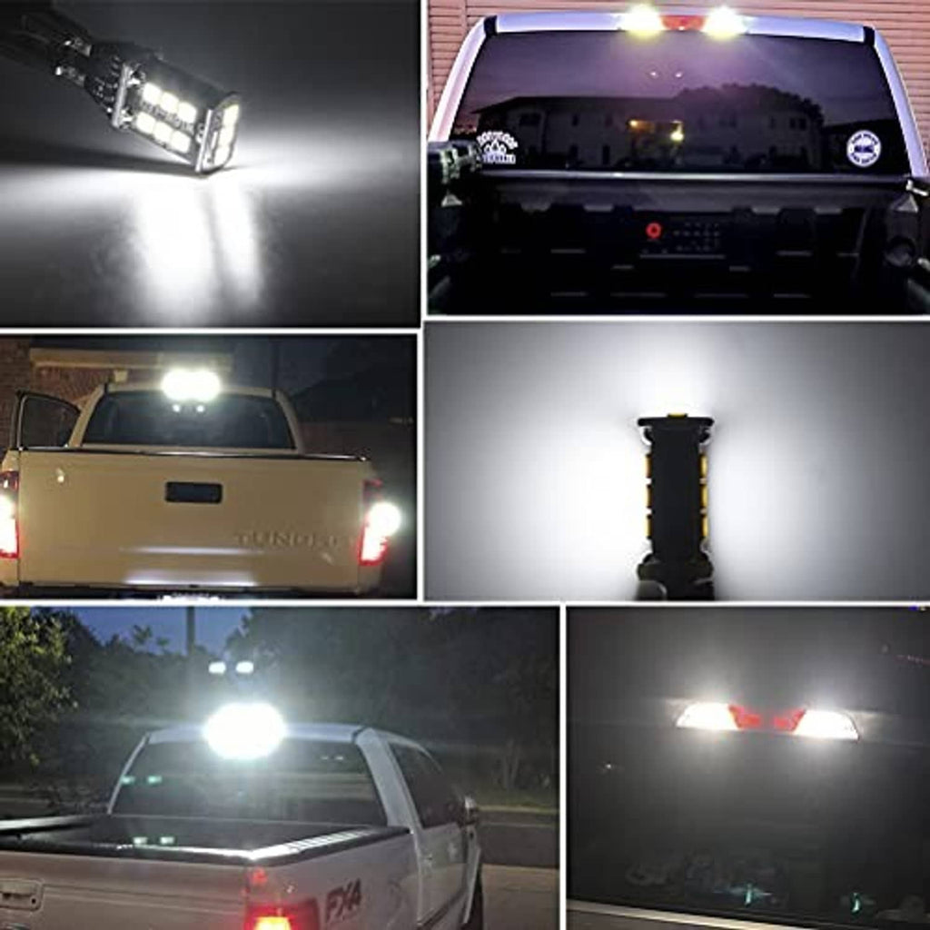 LED third brake light bulbs illuminated, two black bases emitting bright white light