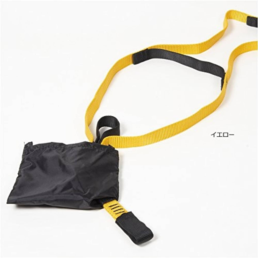 Close-up of yellow webbing with black pocket pouch and strap loops