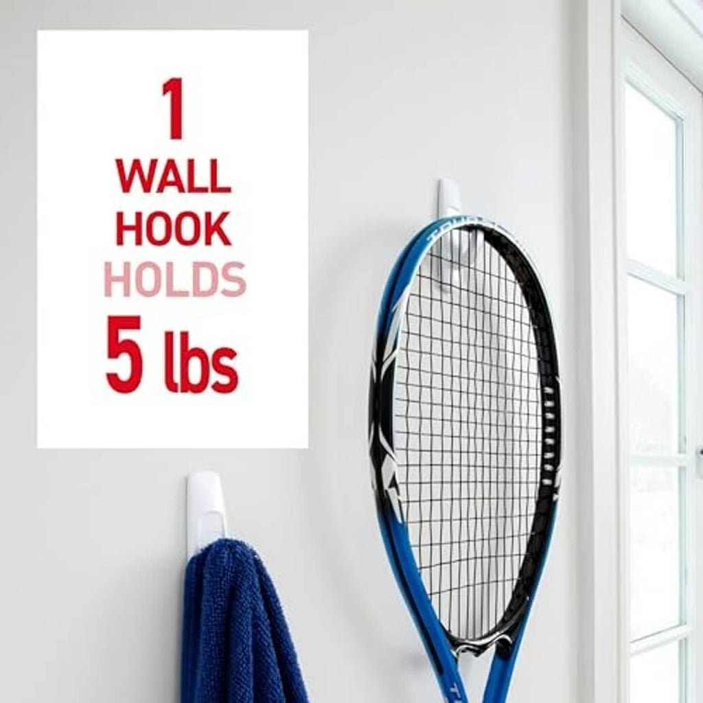 White Command wall hook holding a tennis racket with damage-free adhesive mounting
