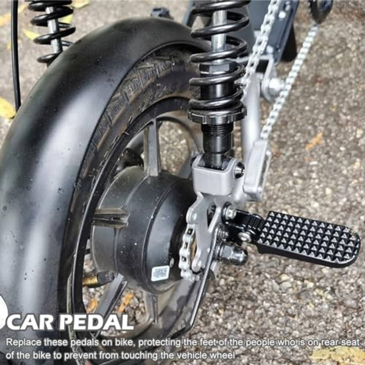 Bike foot peg attached to the rear wheel area with textured non-slip tread