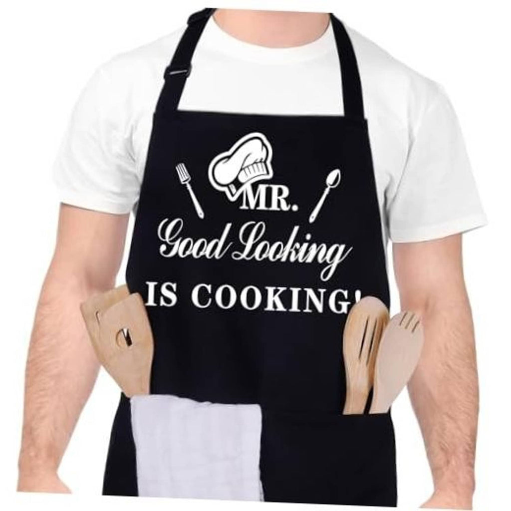 Black kitchen apron with “MR. Good Looking IS COOKING!” graphic and logo tools