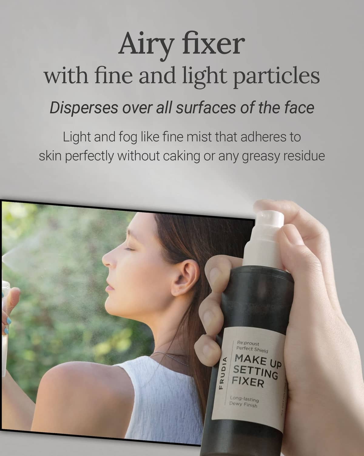 Makeup setting fixer bottle held to spray fine mist toward woman's face