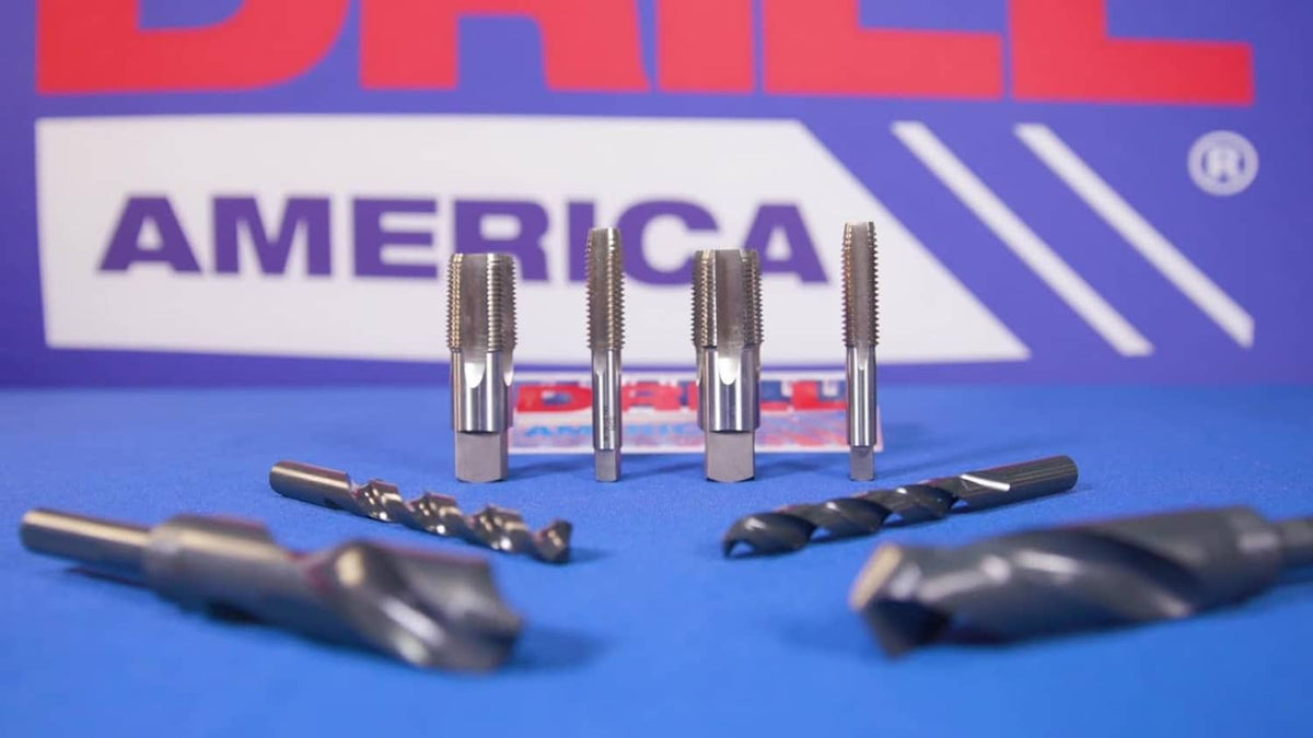 Tap and drill bit kit with multiple tools laid out