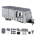 Gray RV trailer cover with fitted roof, side straps, and corner grommets