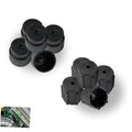 Set of black ribbed air conditioning valve caps with central holes and open ends