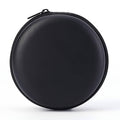 Black round hard-shell earphone case with textured finish and surrounding zipper