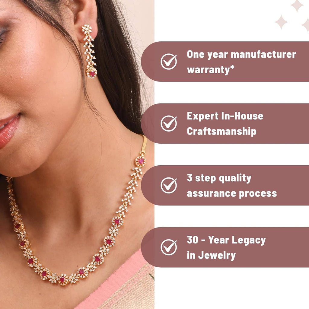 Gold-tone CZ necklace and earrings with purple stones on model wearing pink sari