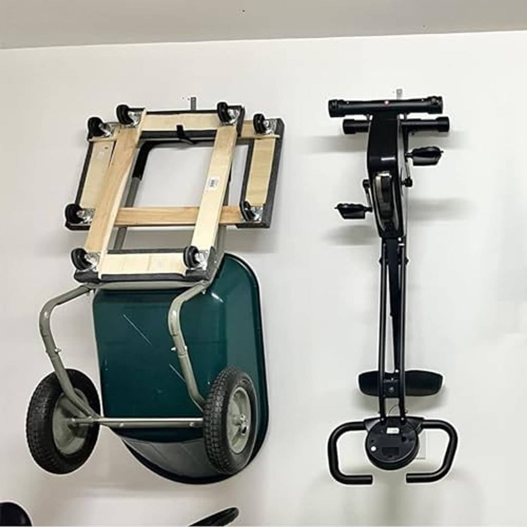 Black wall mount hooks attached to a board, holding tools by the curved arms