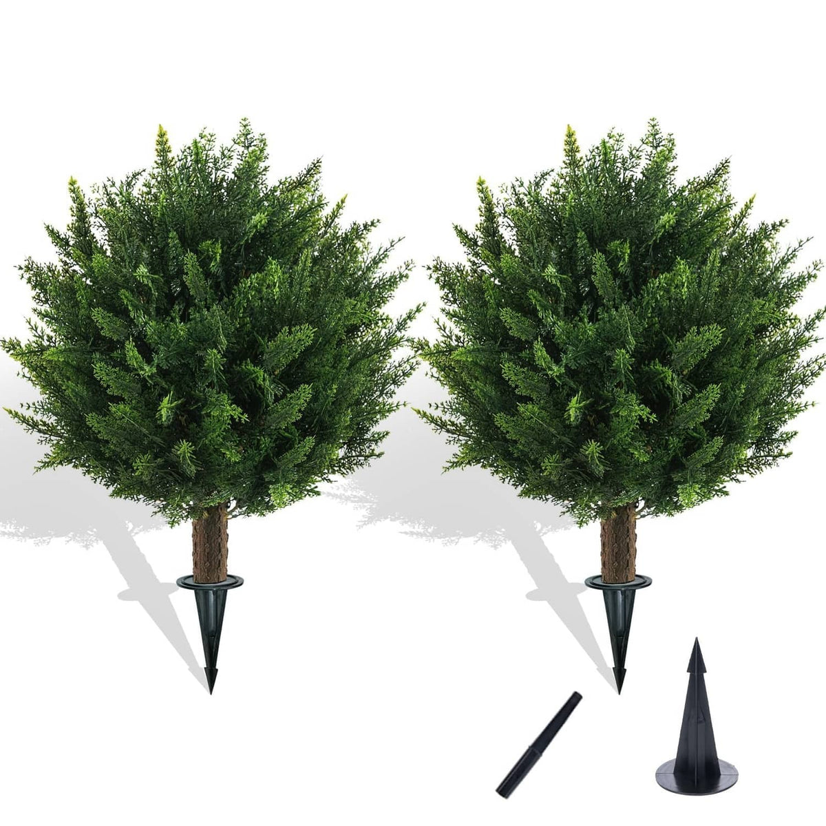 Artificial cedar ball topiary trees set with black ground spikes and base pieces