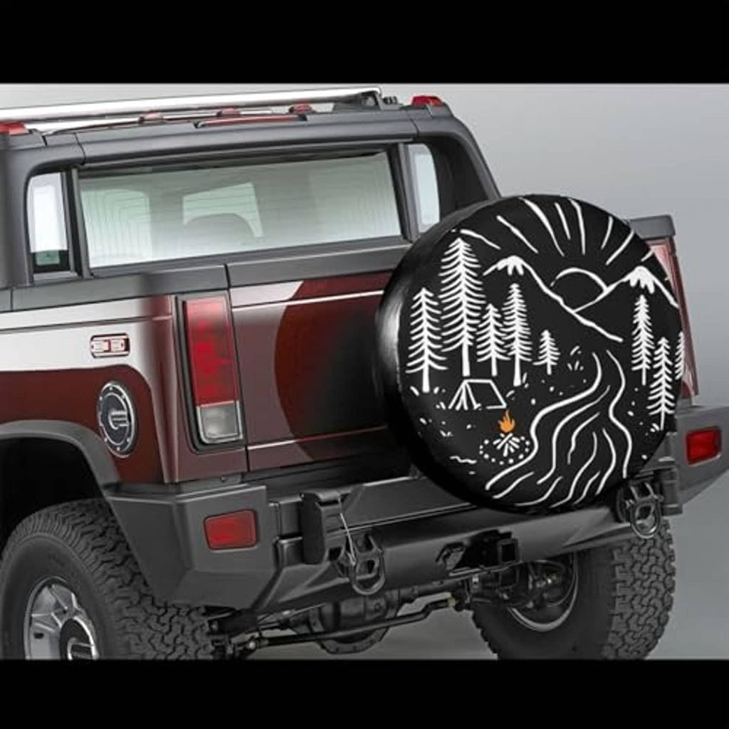 Spare tire cover on SUV rear, black with white forest and mountain illustration