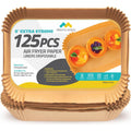 Tan rectangle air fryer paper liner sheet with scalloped, ruffled edges