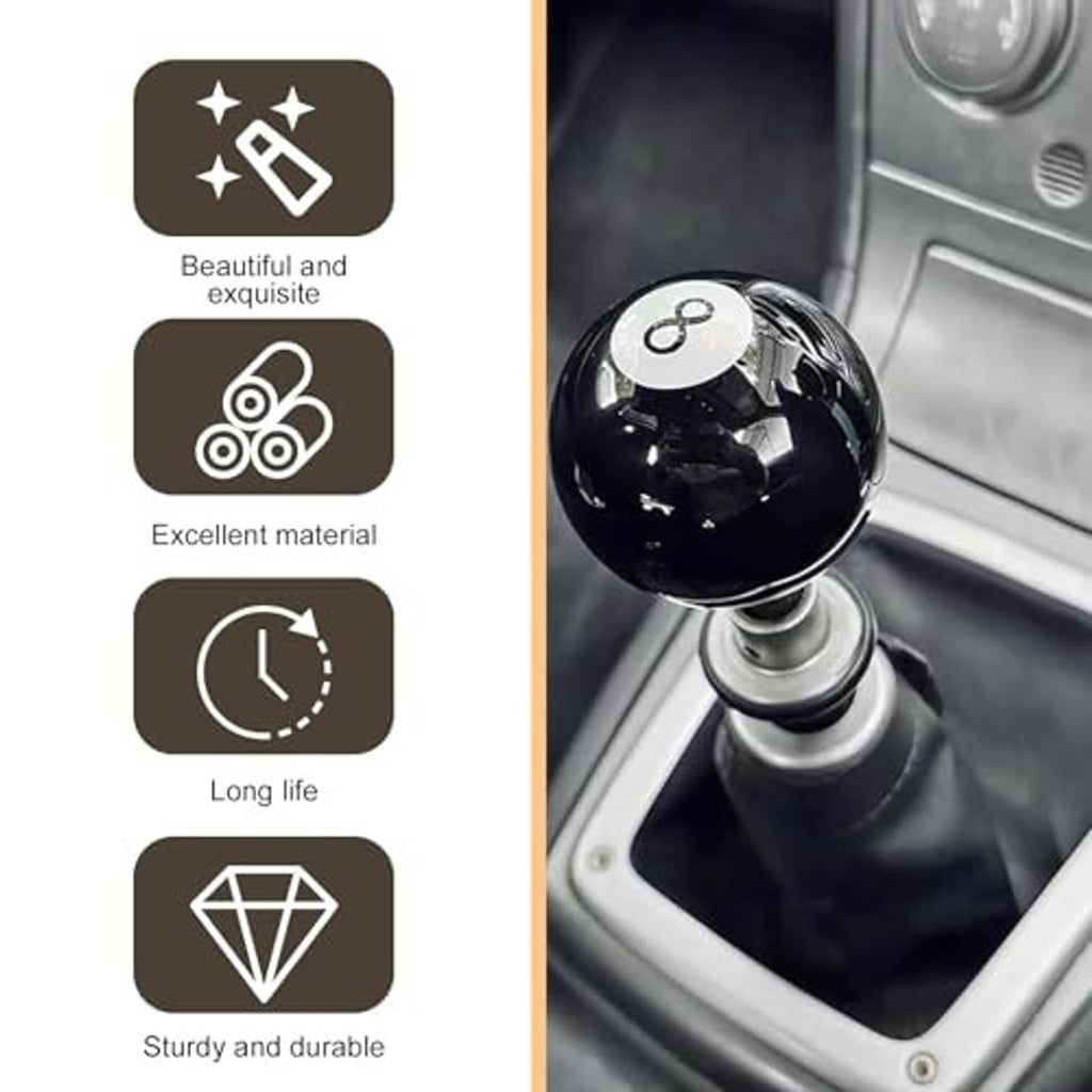 Black glossy 8-ball gear shift knob installed on manual transmission in car interior