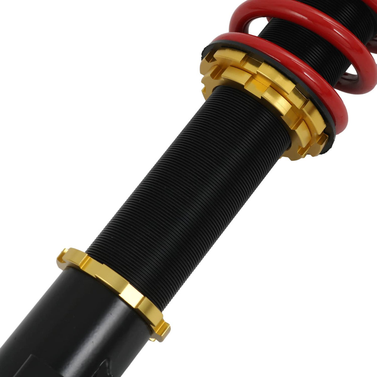 Close-up of coilover strut spring with red coils and black body, gold adjuster ring