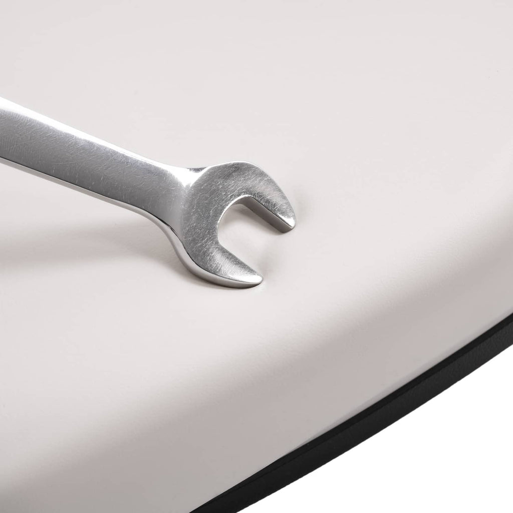 White seat backrest edge with silver metal mounting bracket