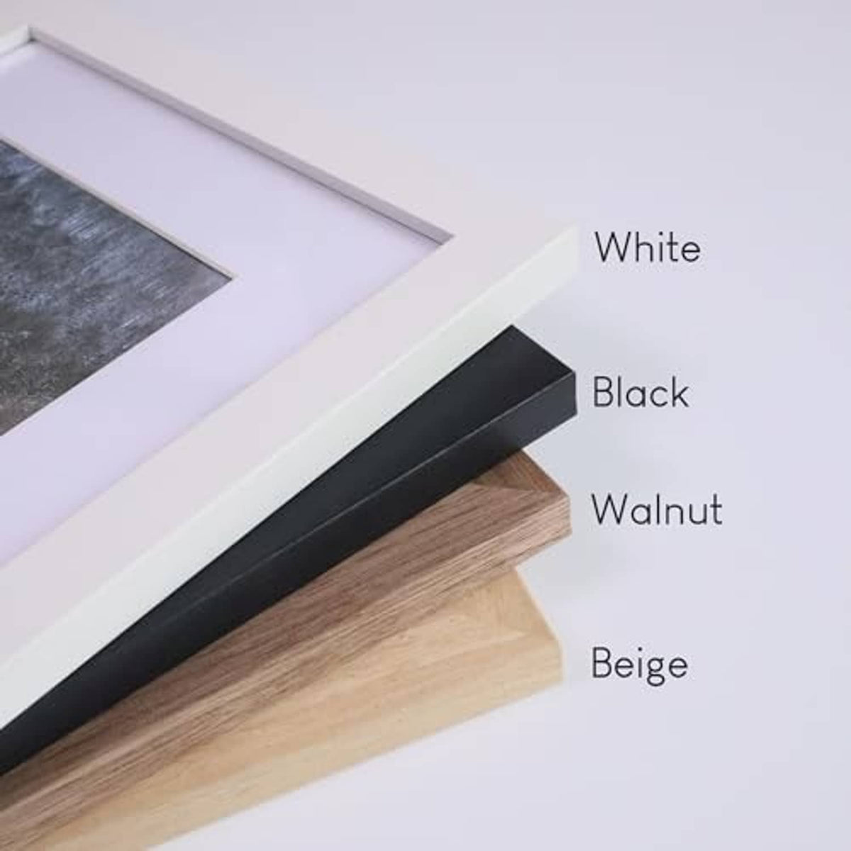 Assorted wood picture frame colors: white, black, walnut, and beige with mats