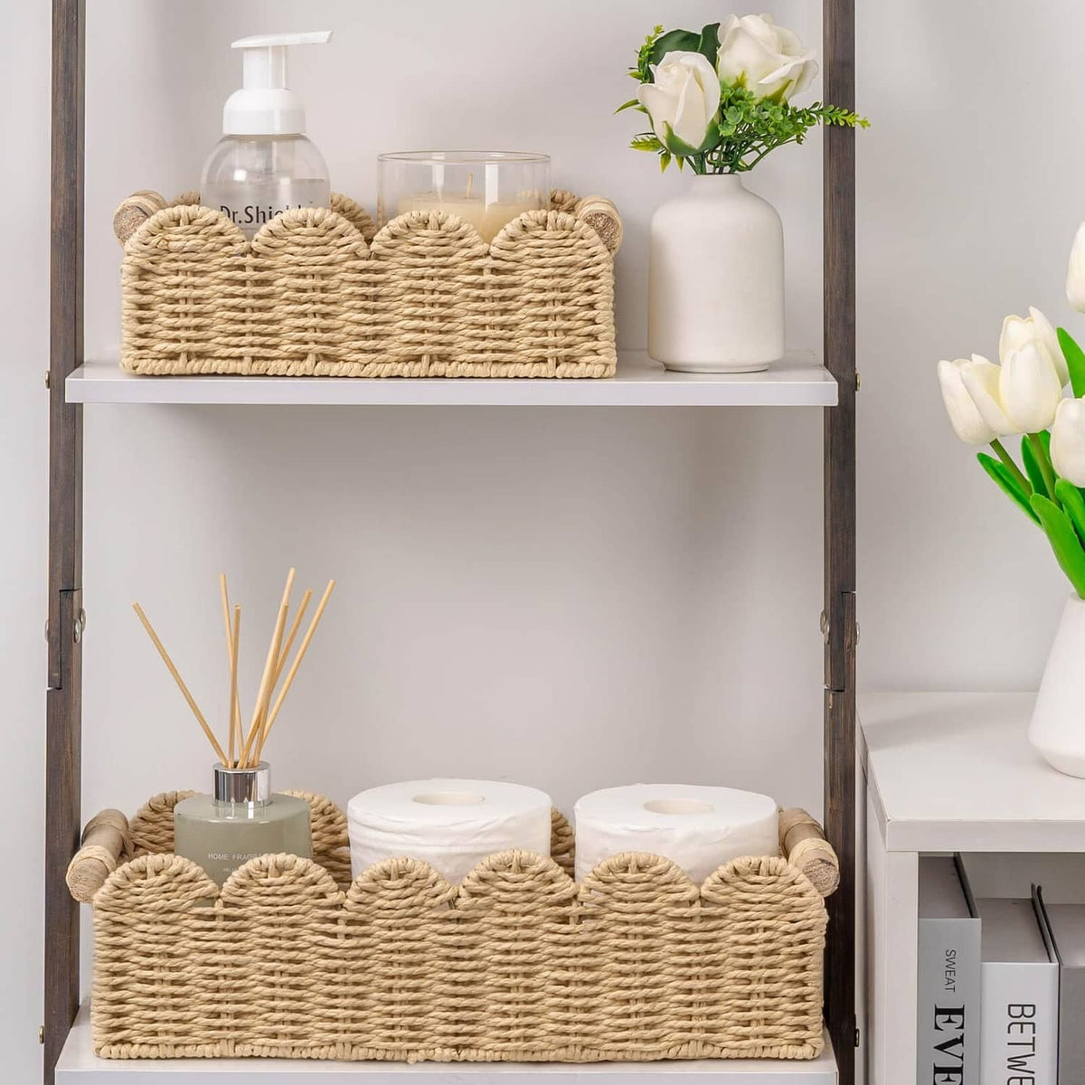 Beige scalloped woven toilet paper storage basket on a bathroom shelf