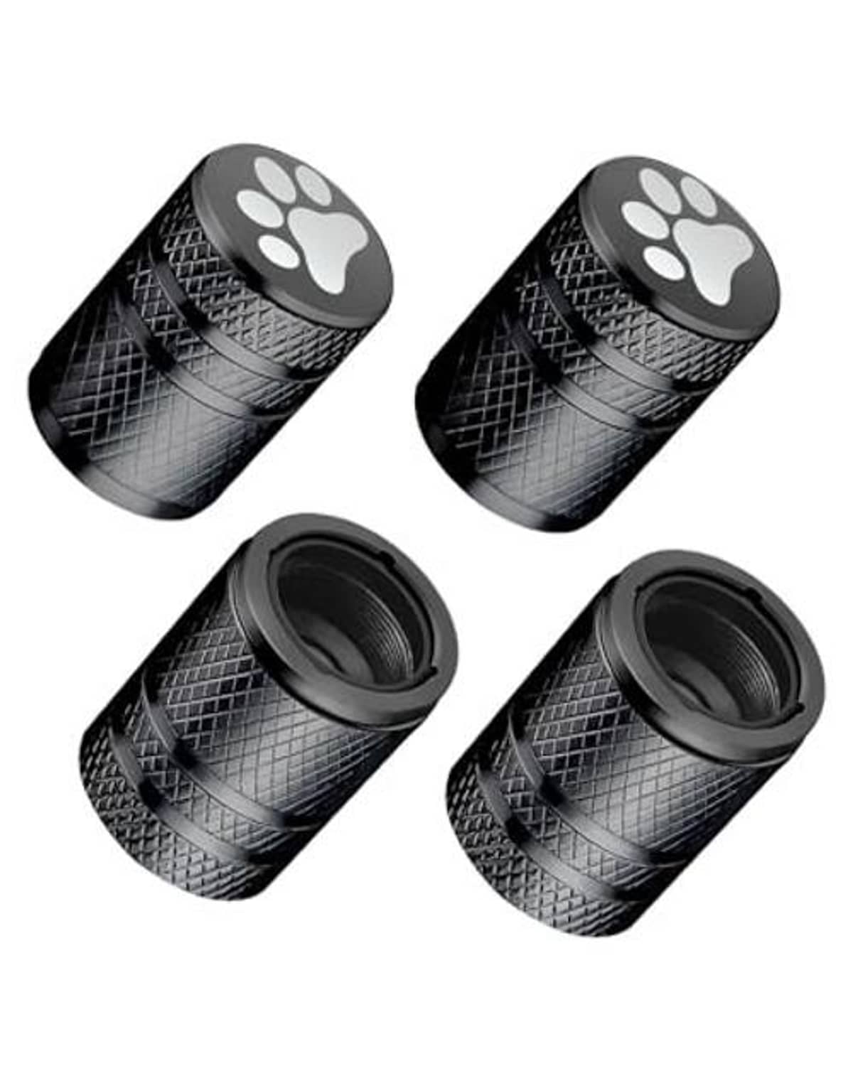 Four black cat-paw tire valve stem caps, angled view with textured grip