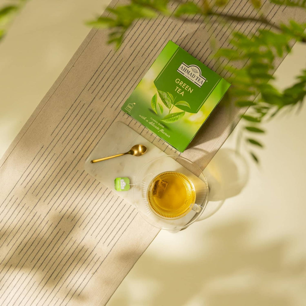 Ahmad Tea Green Tea box with cup, spoon, and small green tea sachet