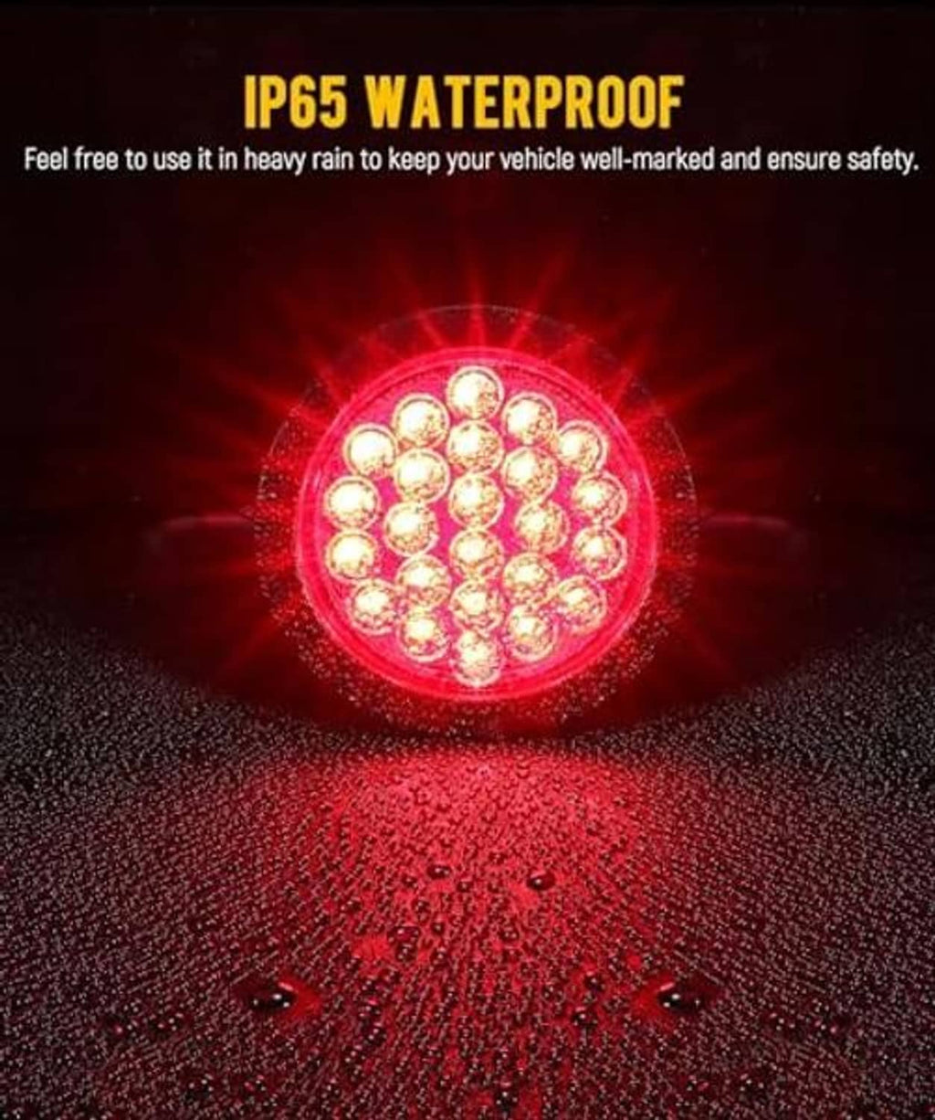 IP65 waterproof red round LED trailer light with bright illuminated beam, all LEDs glowing.