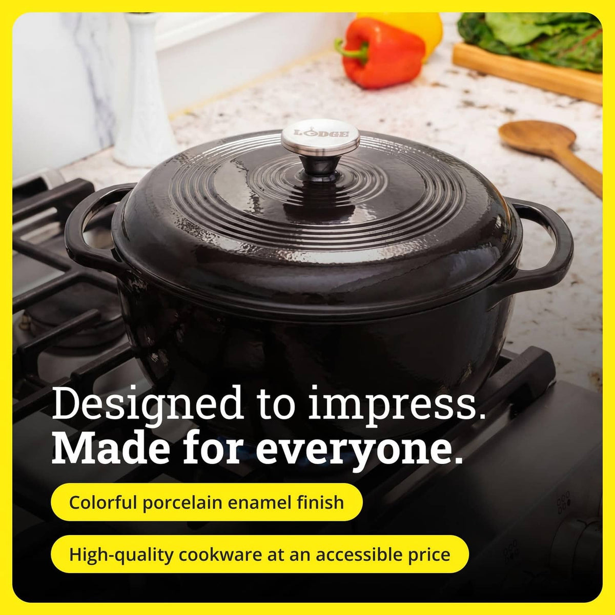 Dark enamel cast iron Dutch oven with lid knob and side handles on a stovetop