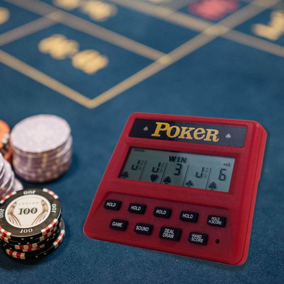 Red handheld poker electronic game with LCD screen and button row visible.