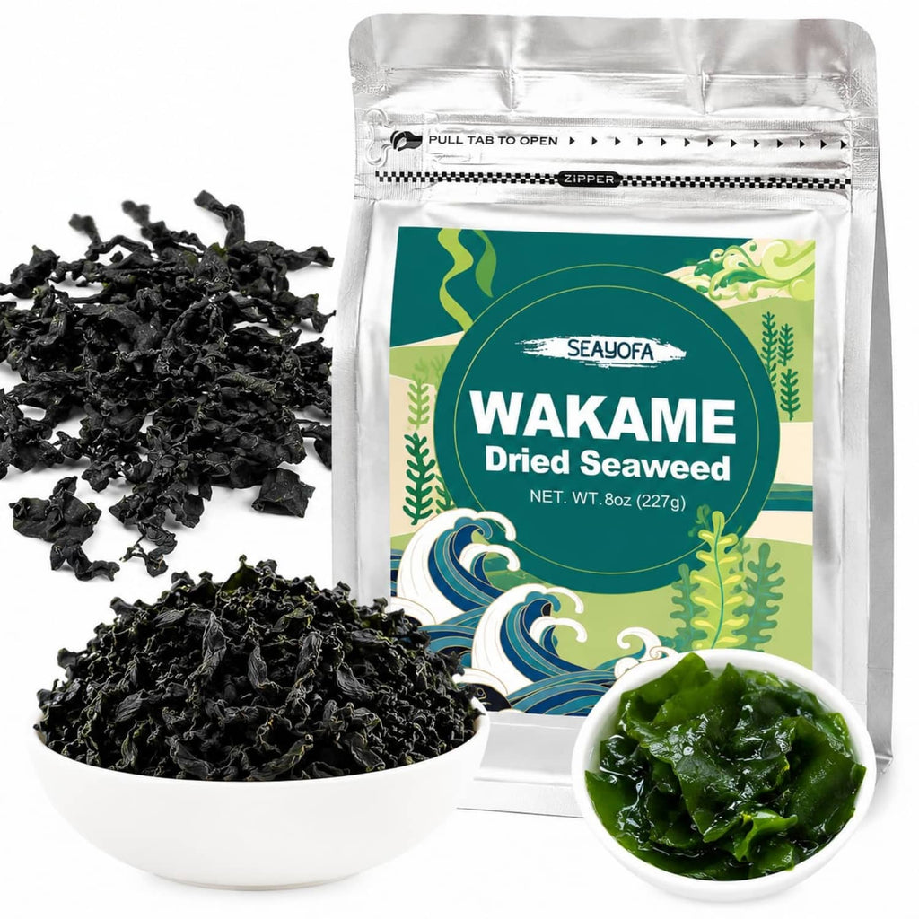 Dried wakame seaweed pouch with a pile of black seaweed and a bowl of rehydrated greens