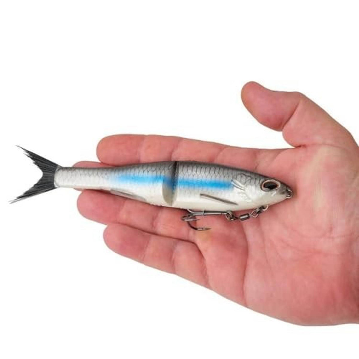 Glide bait soft plastic lure held in hand, silver-blue body and treble hooks