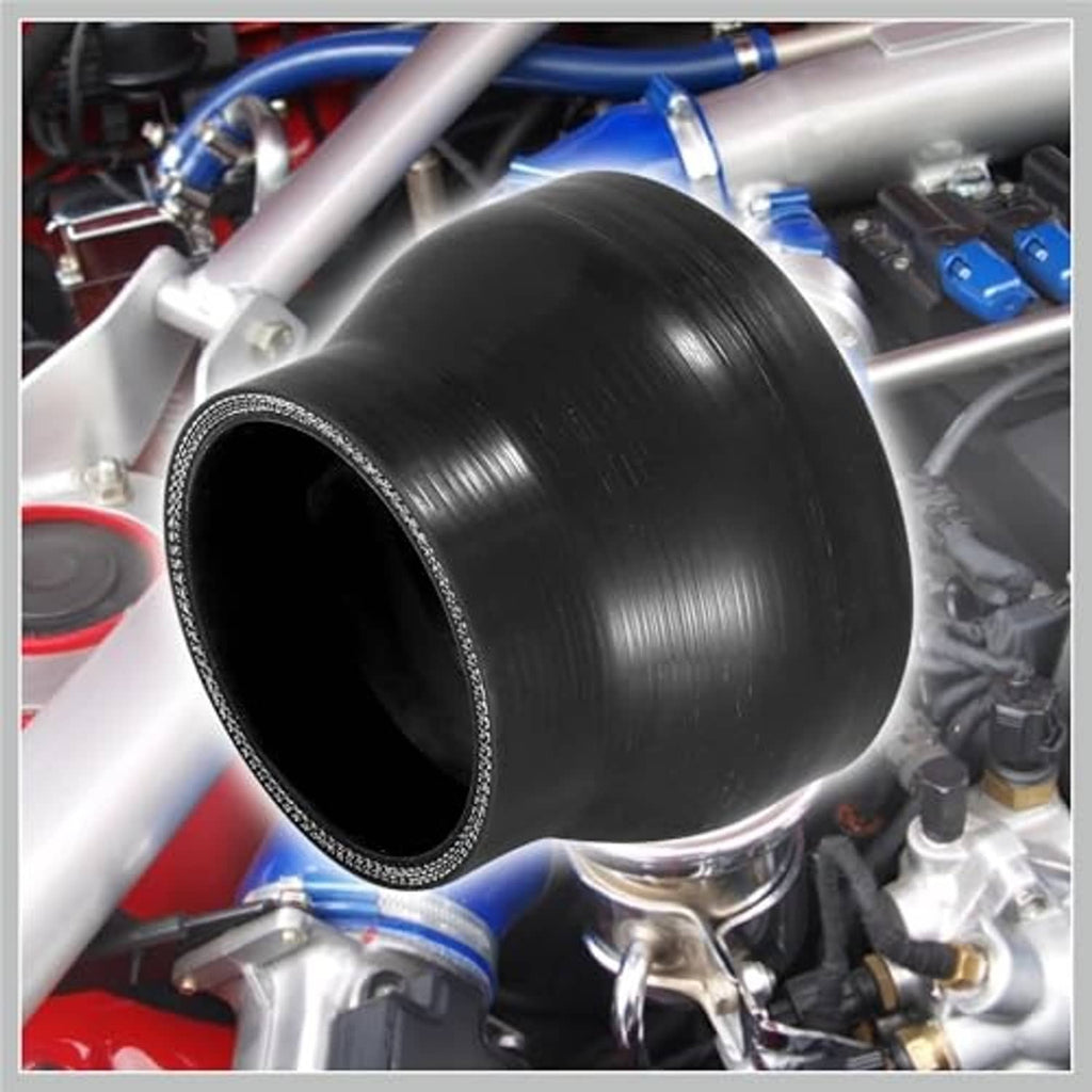 Black silicone hose reducer coupler installed between pipes, thick flexible tubing