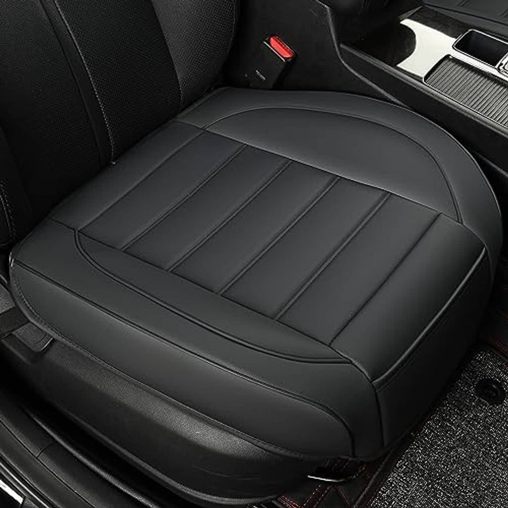 Black front seat bottom cover close-up with stitched center panels and smooth top edge