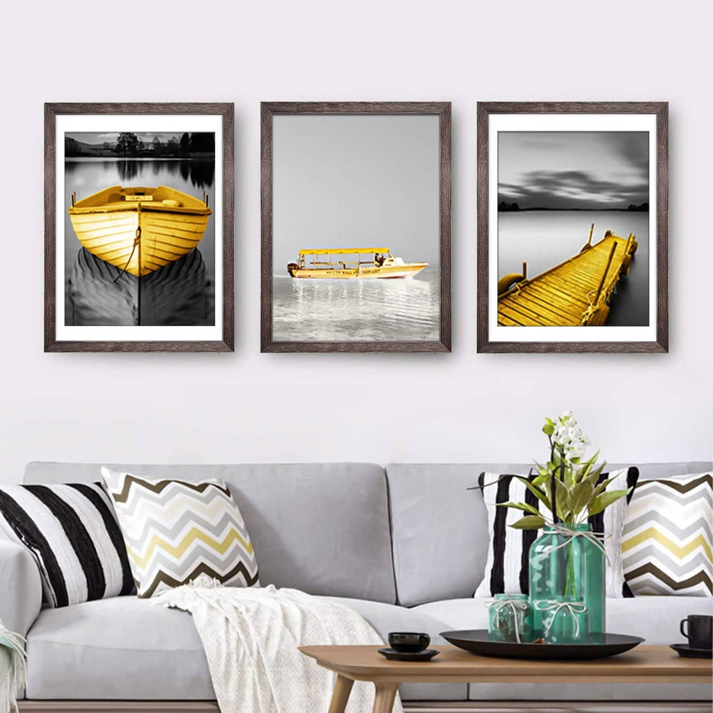 Set of three rustic brown picture frames with white mat borders, landscape scenes