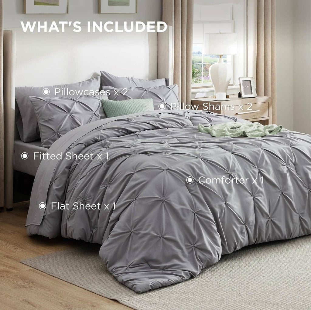 Grey queen bed in a bag set layout: comforter, fitted sheet, flat sheet, shams