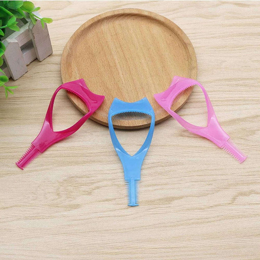 Three eyelash shield tools on wooden surface: pink and blue protectors