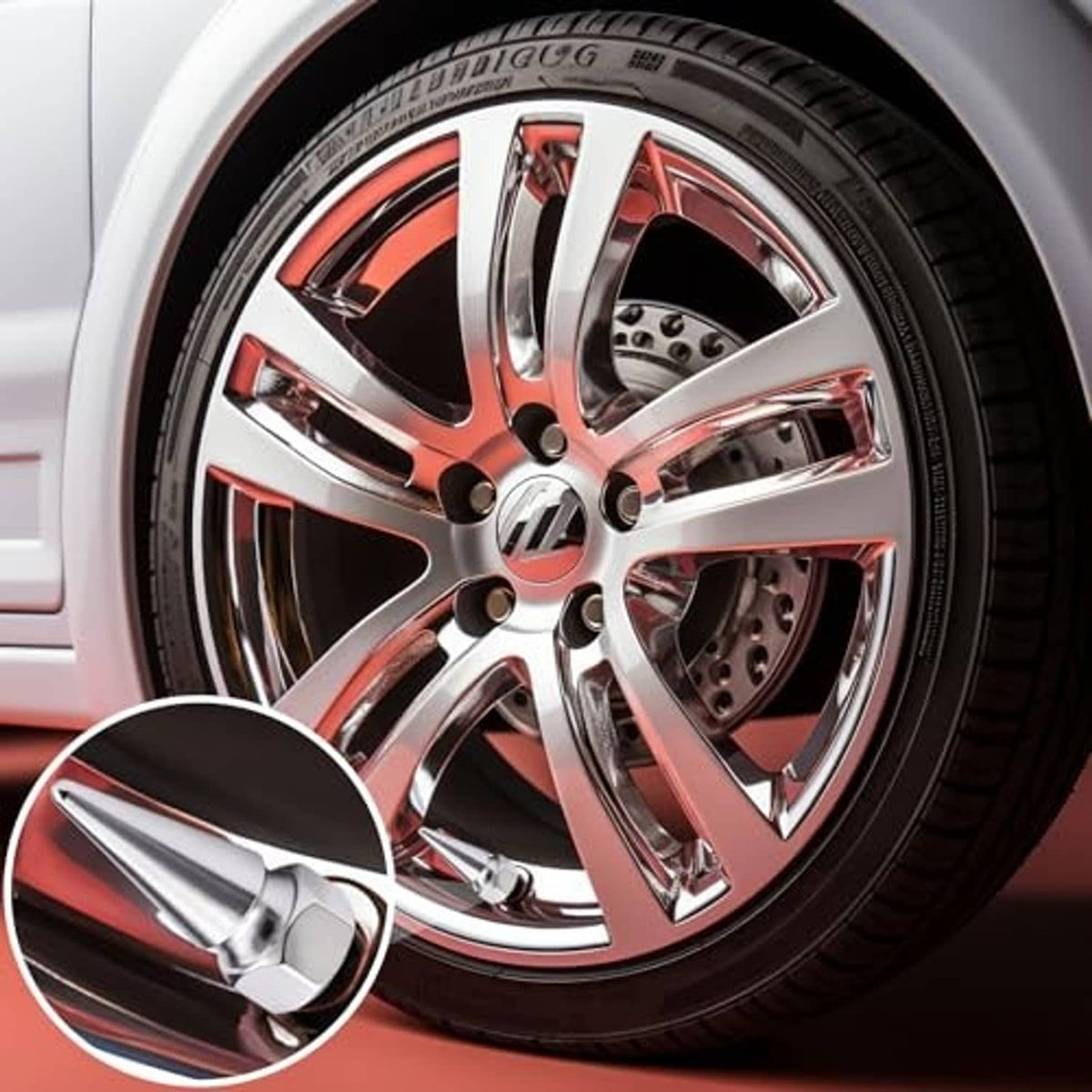 Silver spiked valve stem caps installed on a chrome wheel rim