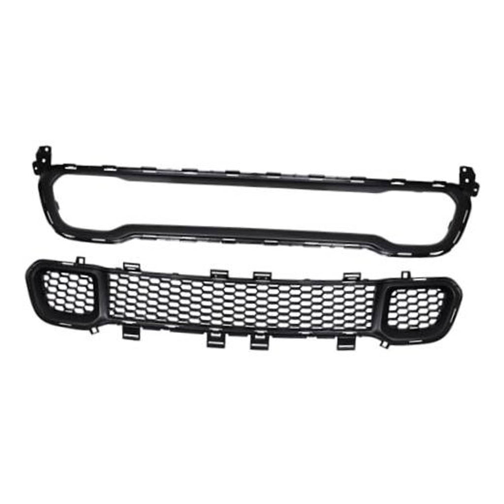 Black front grille with honeycomb mesh center and round mesh side openings