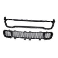 Black front grille with honeycomb mesh center and round mesh side openings