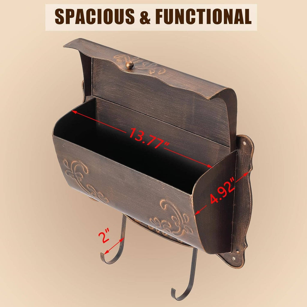 Vintage wall mailbox with open front cavity, dark bronze metal with embossed floral details