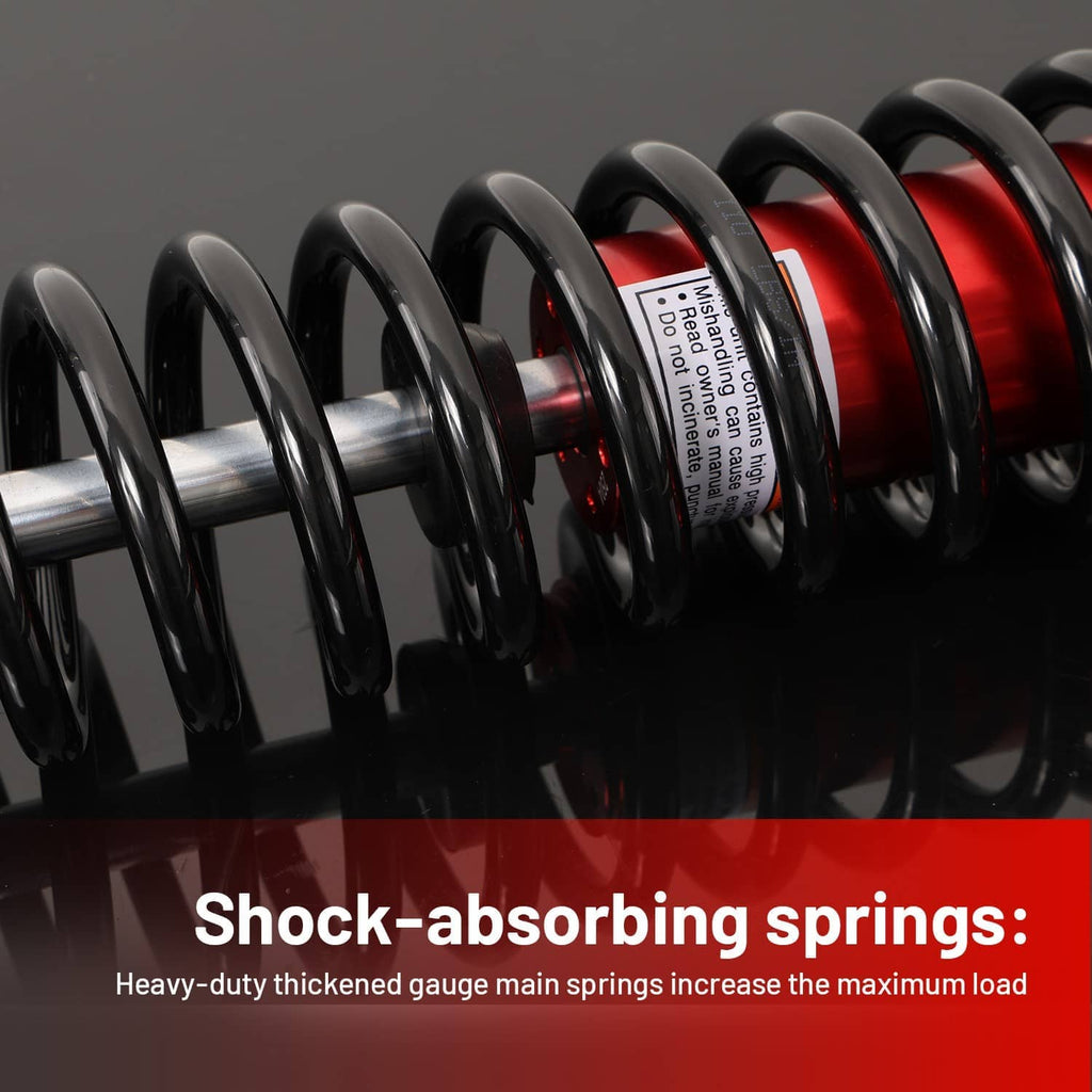 Close-up of black coil springs and red shock body with visible label on spring housing