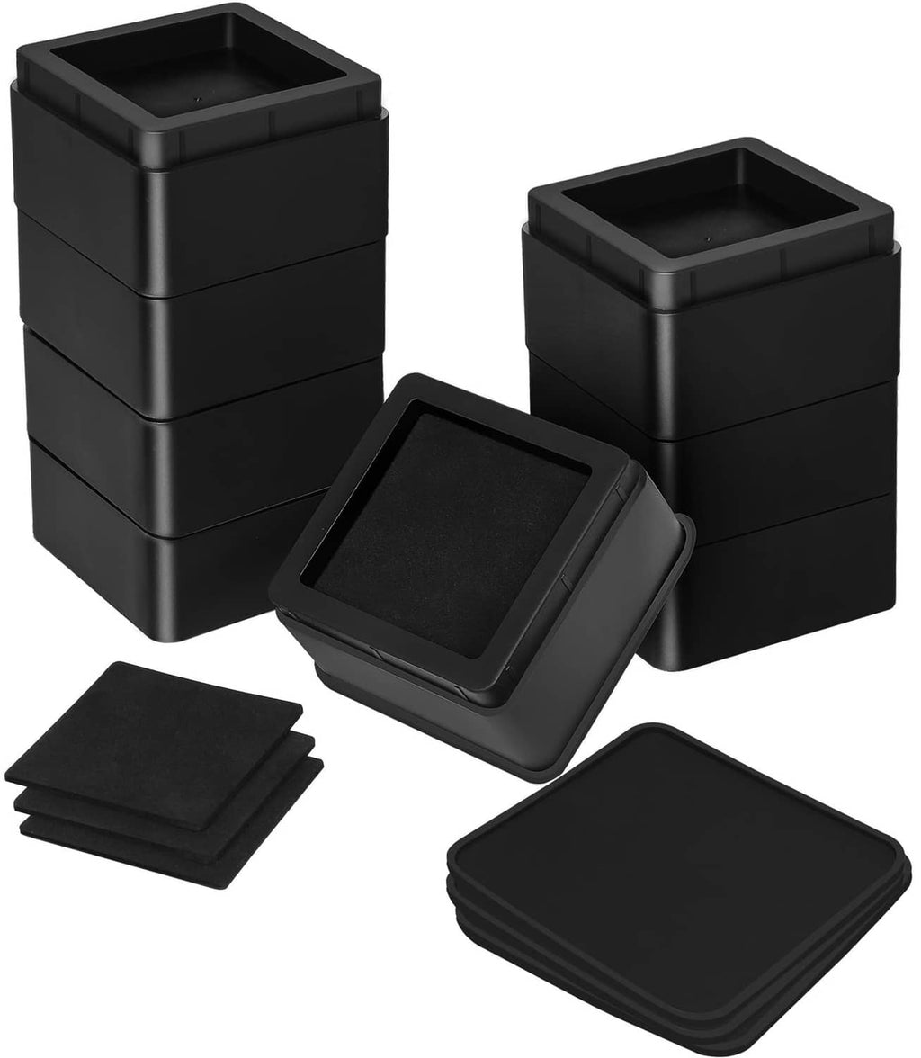 Black square bed risers with hinged top lids and anti-slip pads