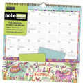 Spiral-bound pocket calendar with colorful illustrated cover and green envelope pocket