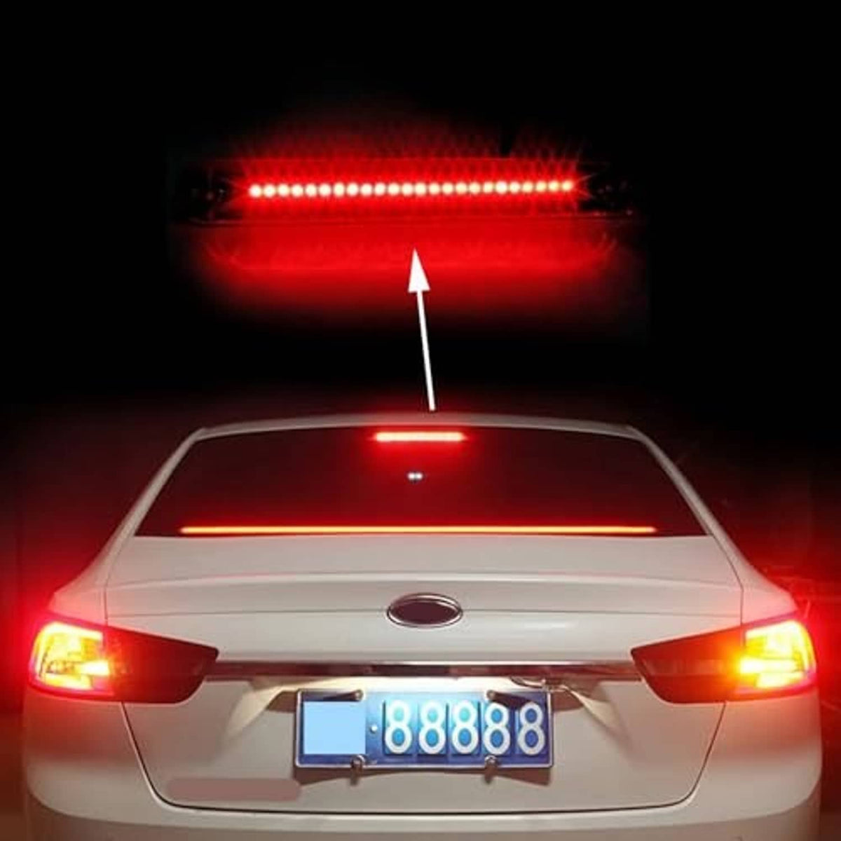 Third brake light bar glowing red LED light strip through clear lens
